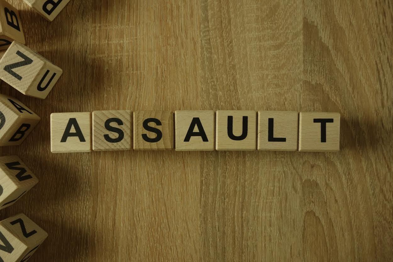Assault word made with Scrabble letters.