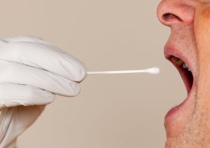 Inside of their cheek swabbed for testing