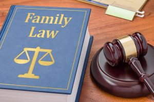 Law book with a gavel - Family law